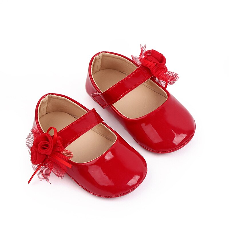 Zapatos de bebé con flor
