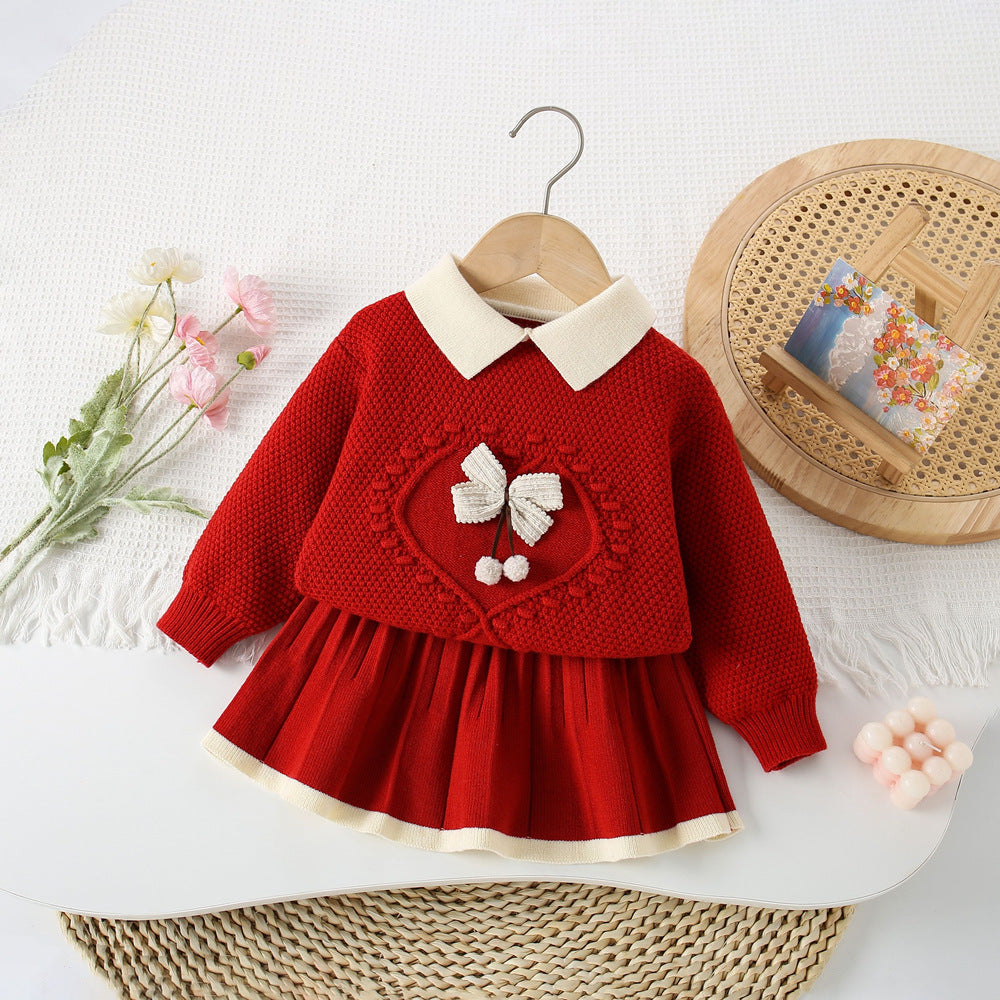 Conjunto de punto con lazo delicado para niña