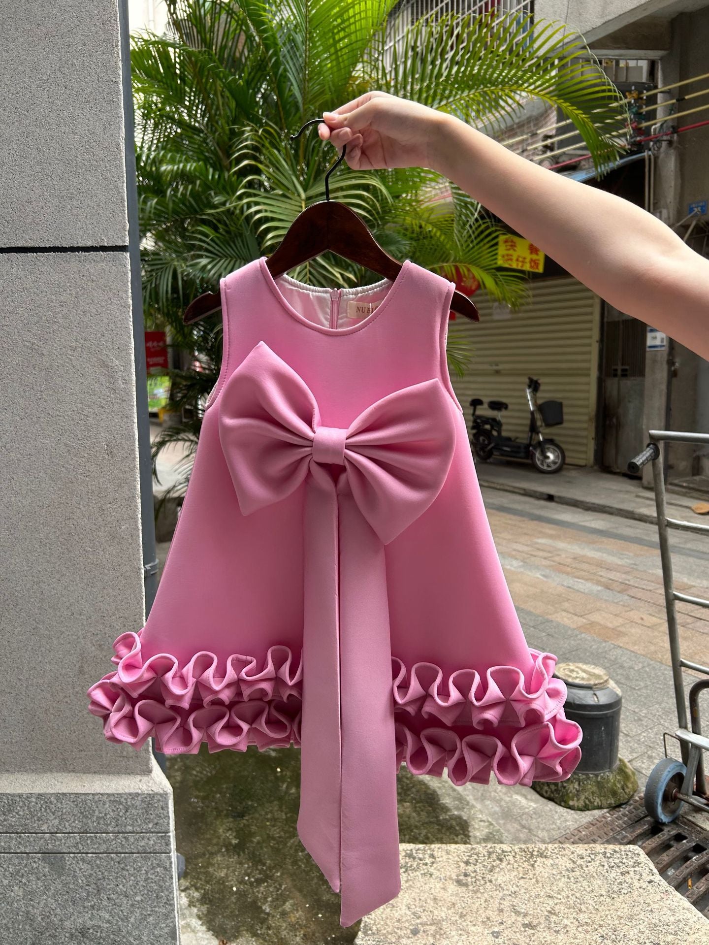 Children's Dress with Ruffles and Bow Hem