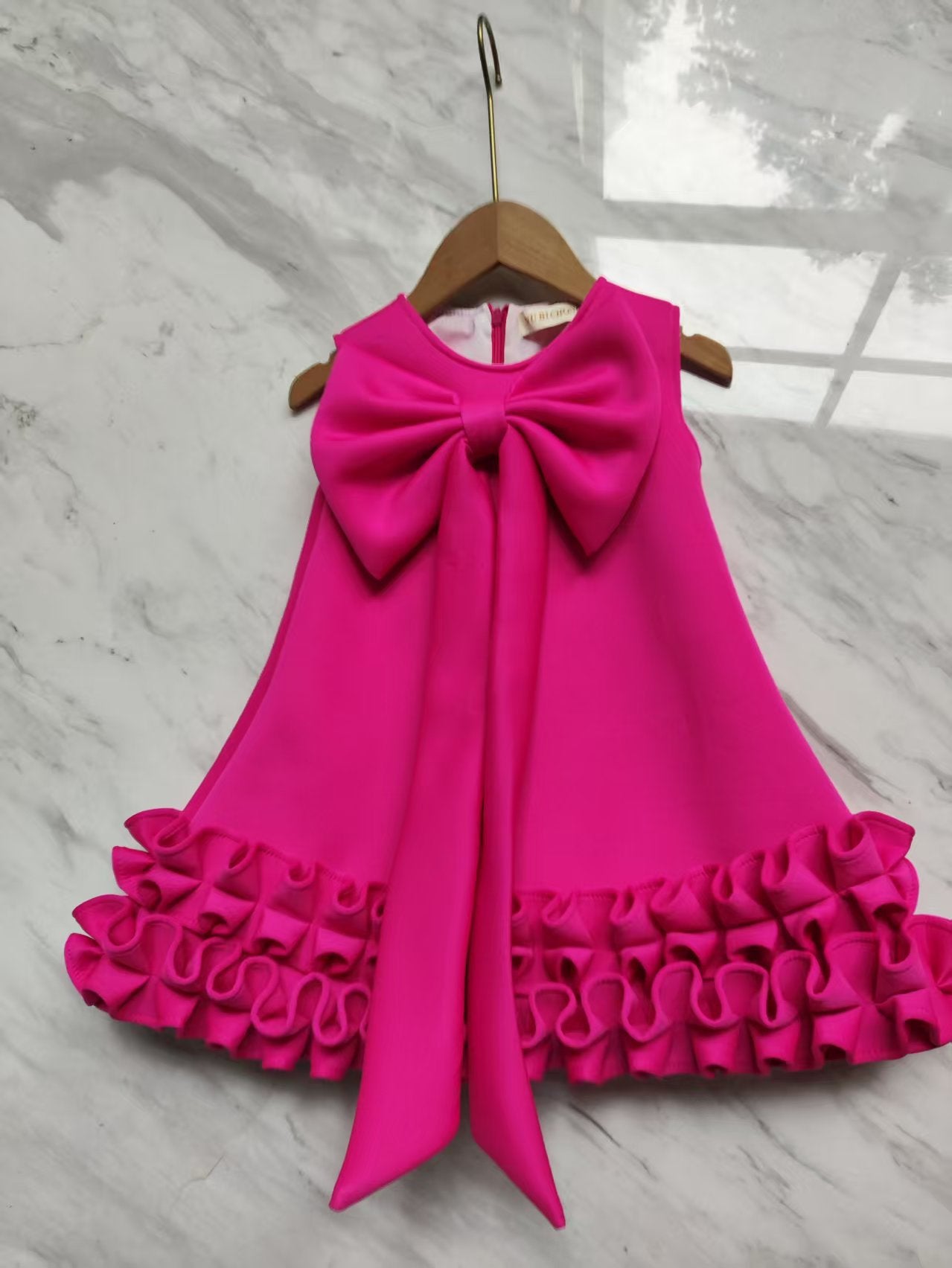 Children's Dress with Ruffles and Bow Hem