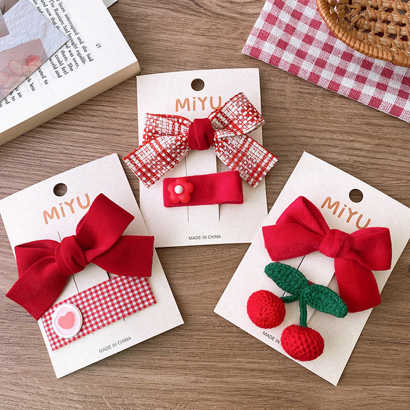 Clips para niños con lazos rojos