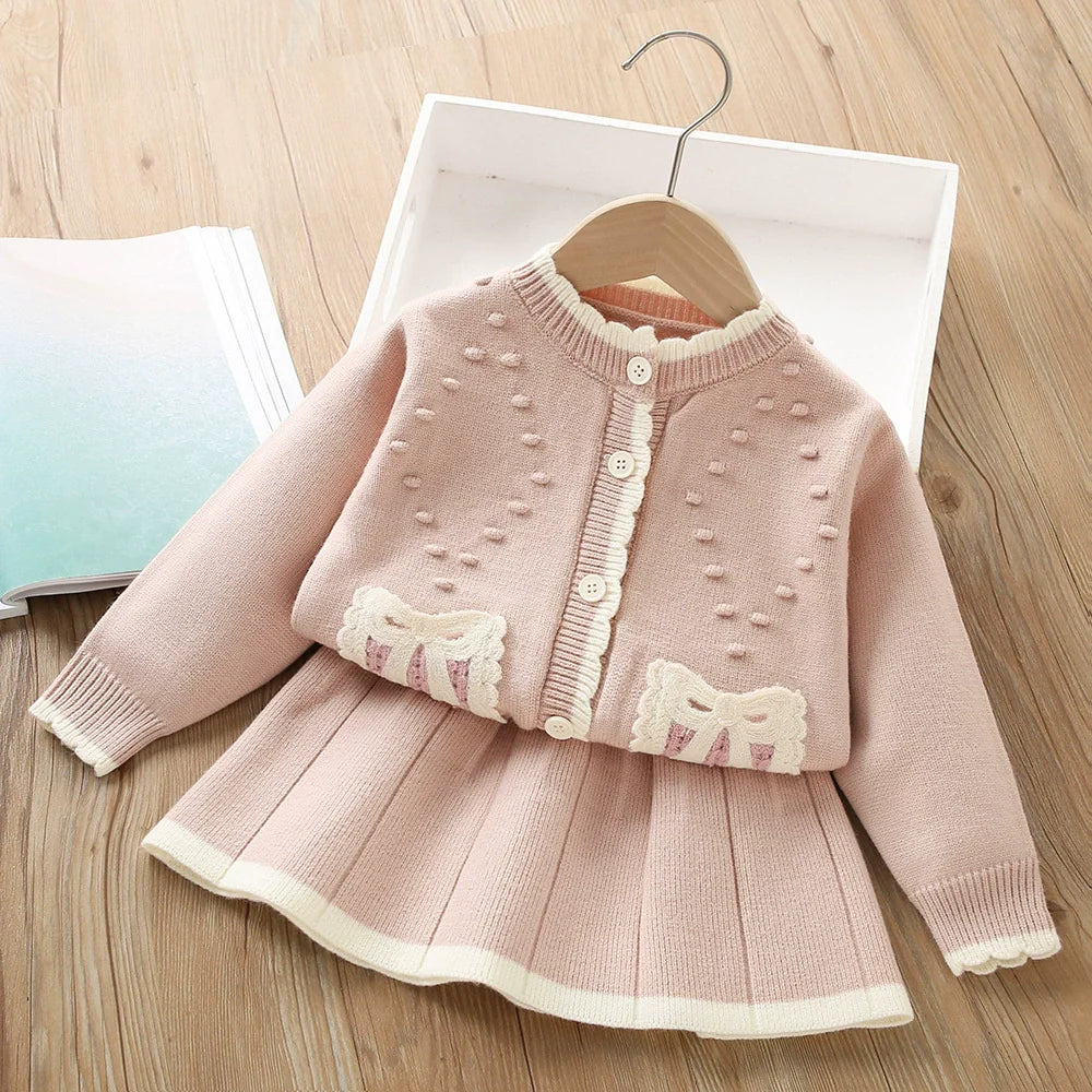 Conjunto de punto con lazo plisado para niña