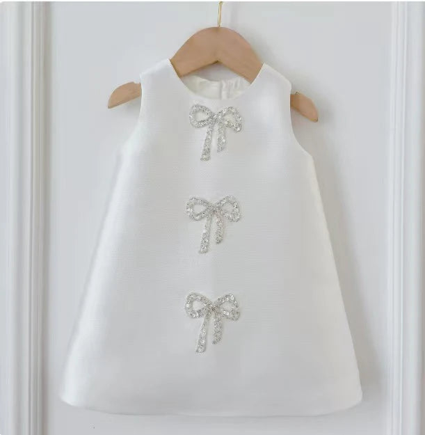 Vestido infantil con lazos brillantes