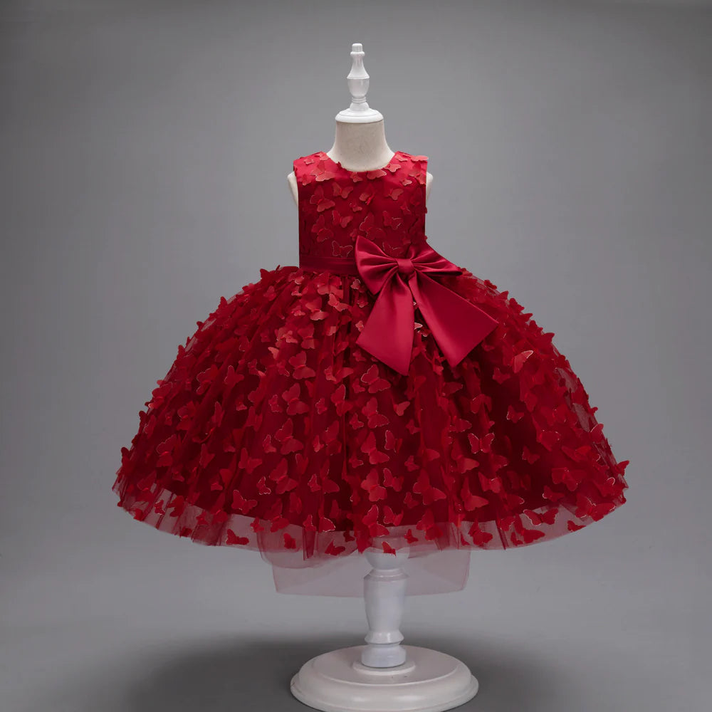 Vestido infantil con mariposas y lazo