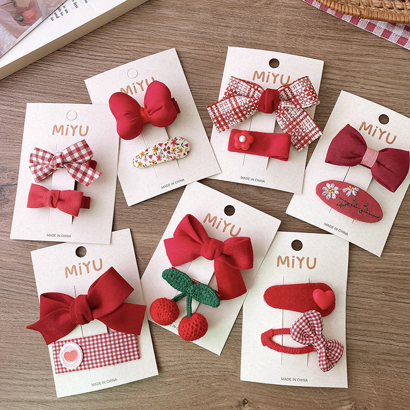 Clips para niños con lazos rojos
