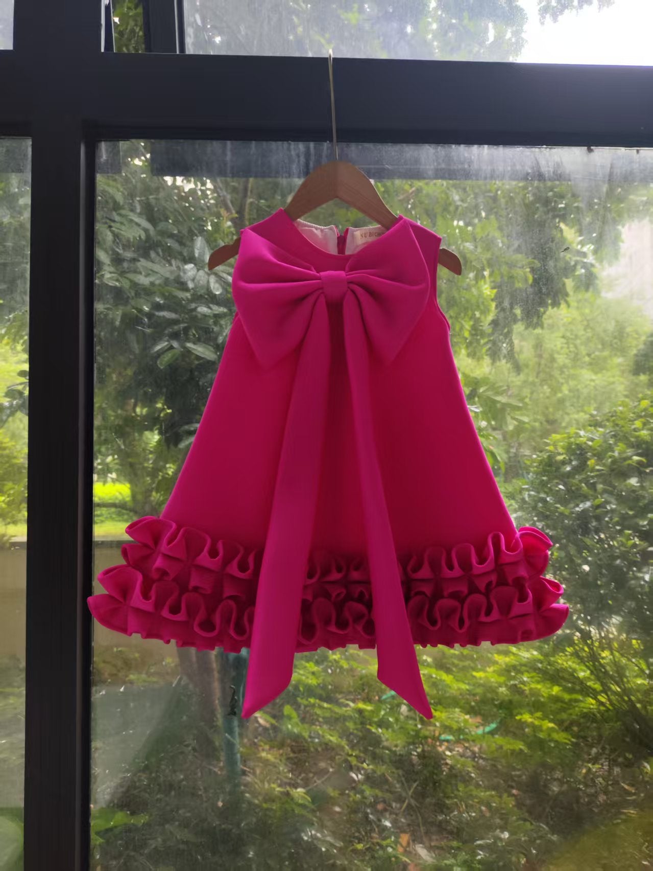 Children's Dress with Ruffles and Bow Hem
