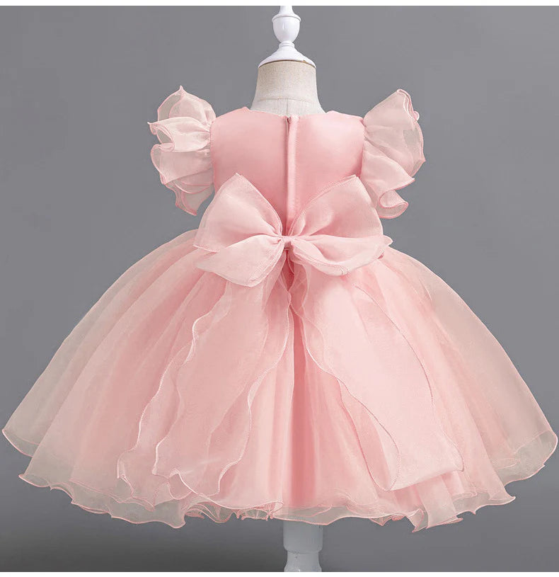 Vestido de fiesta infantil con flores y mangas voladoras