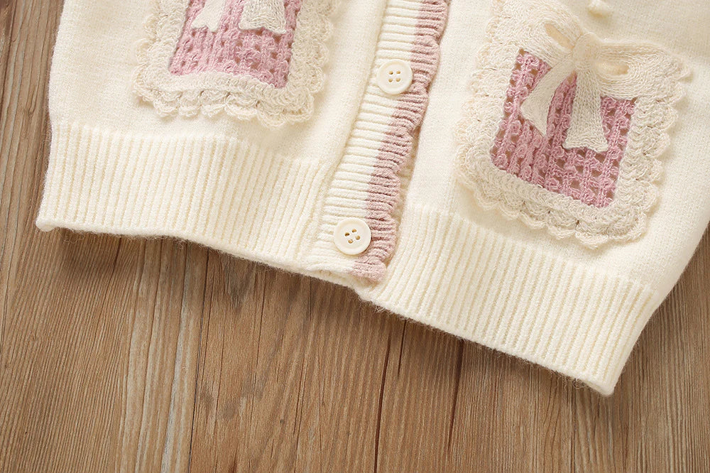 Conjunto de punto con lazo plisado para niña