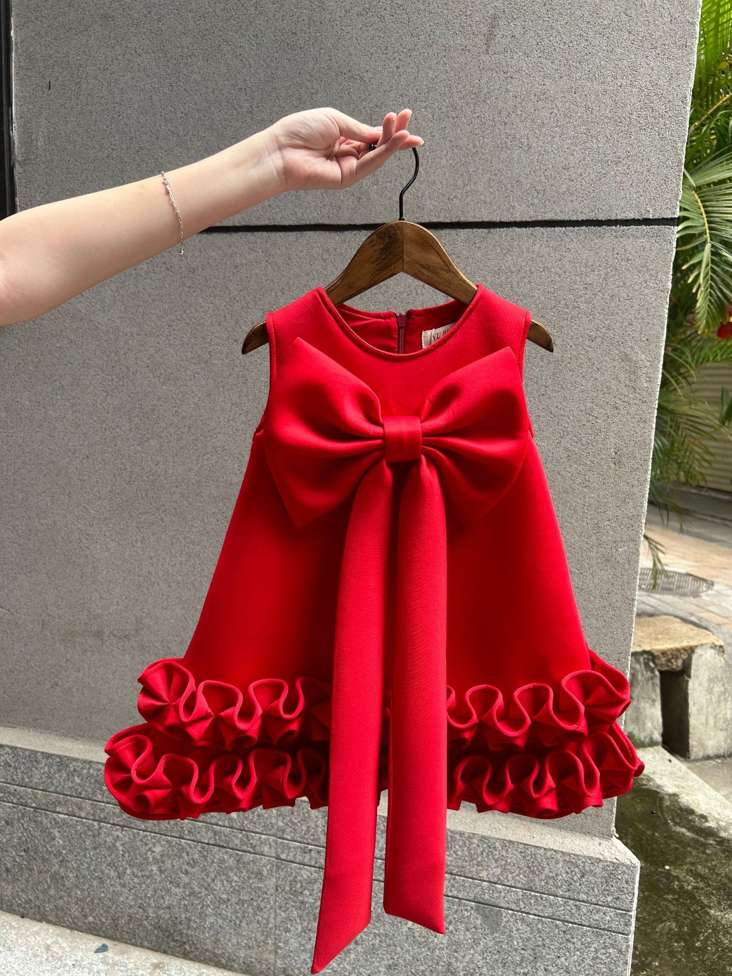 Children's Dress with Ruffles and Bow Hem