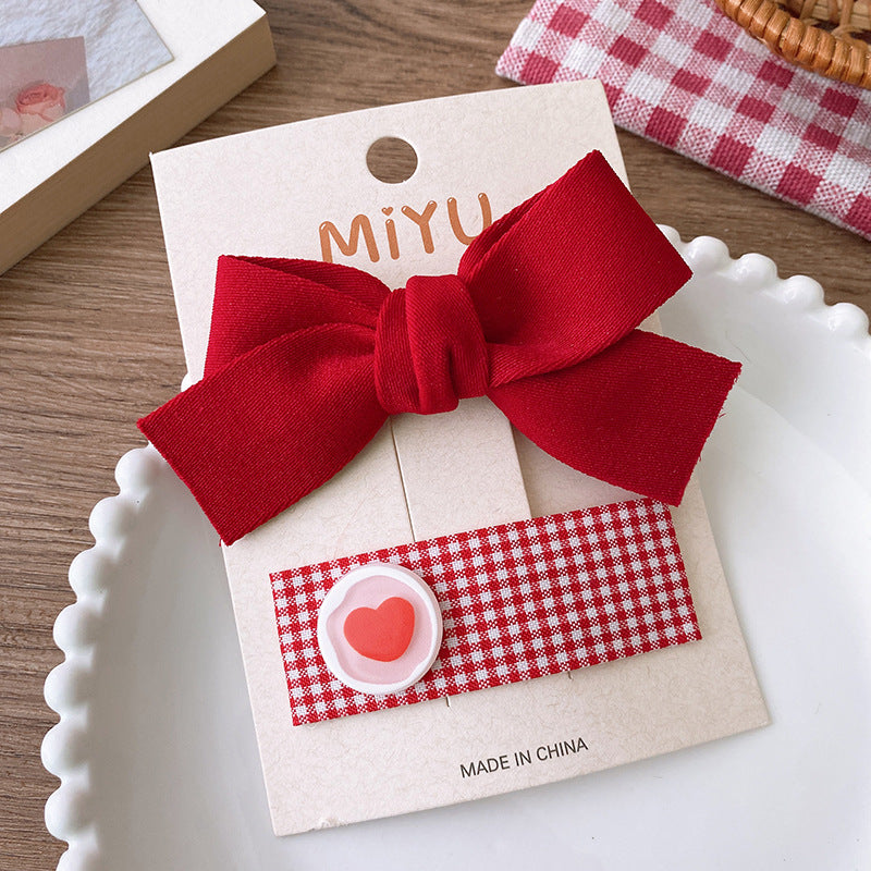 Clips para niños con lazos rojos