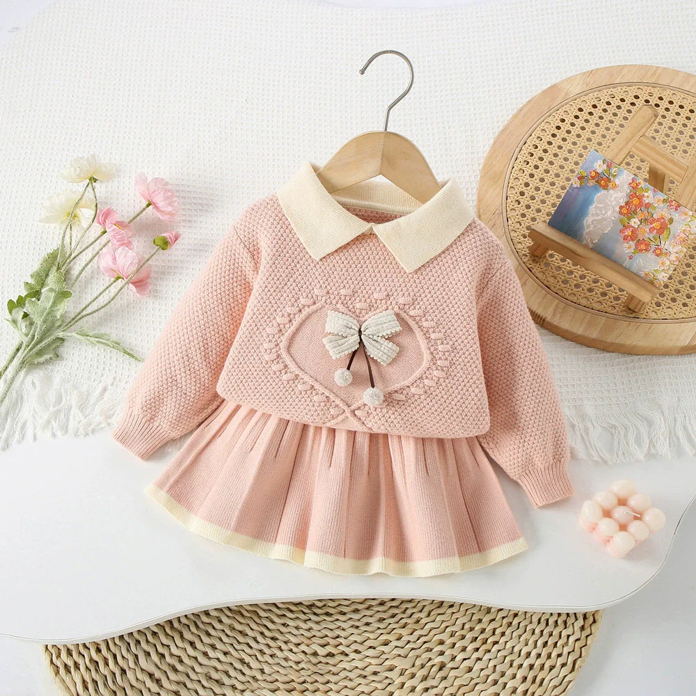 Conjunto de punto con lazo delicado para niña