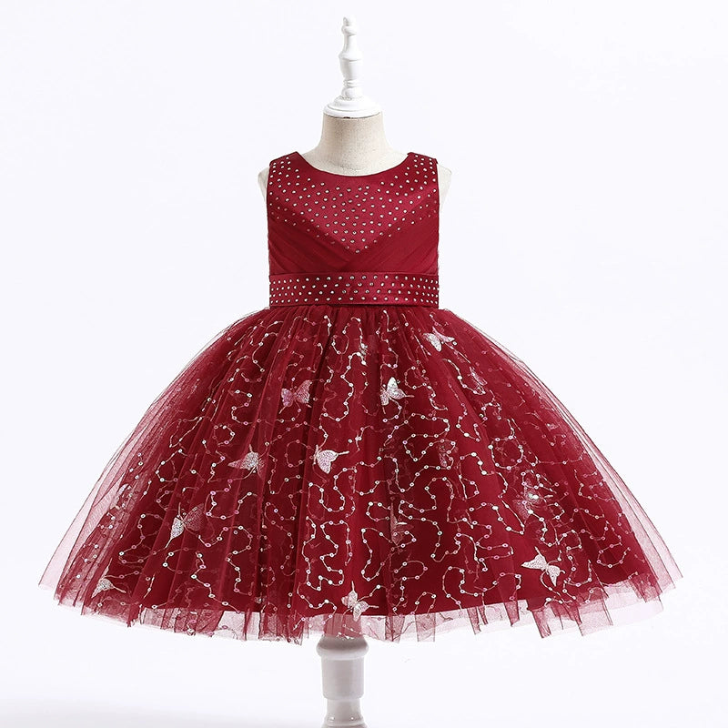 Vestido de fiesta infantil con pedrería y mariposas