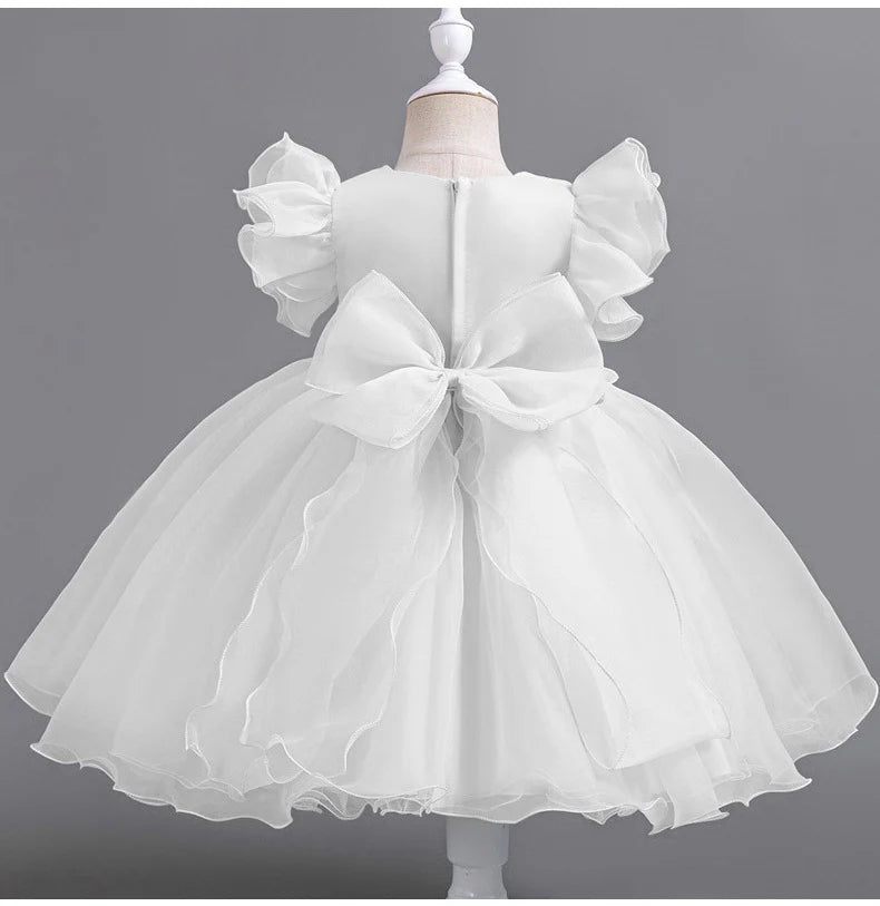 Vestido de fiesta infantil con flores y mangas voladoras