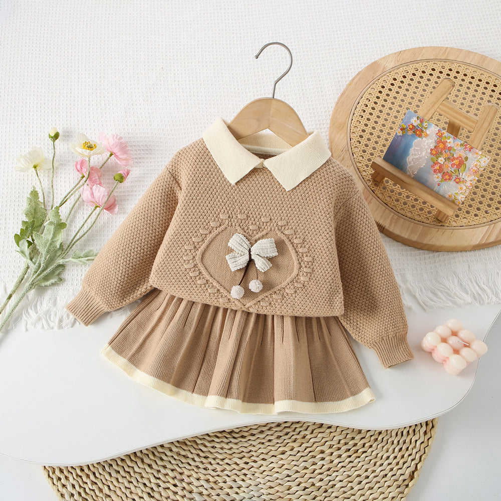 Conjunto de punto con lazo delicado para niña