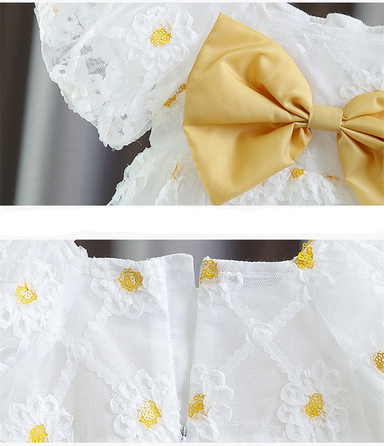 Vestido infantil con lazo amarillo
