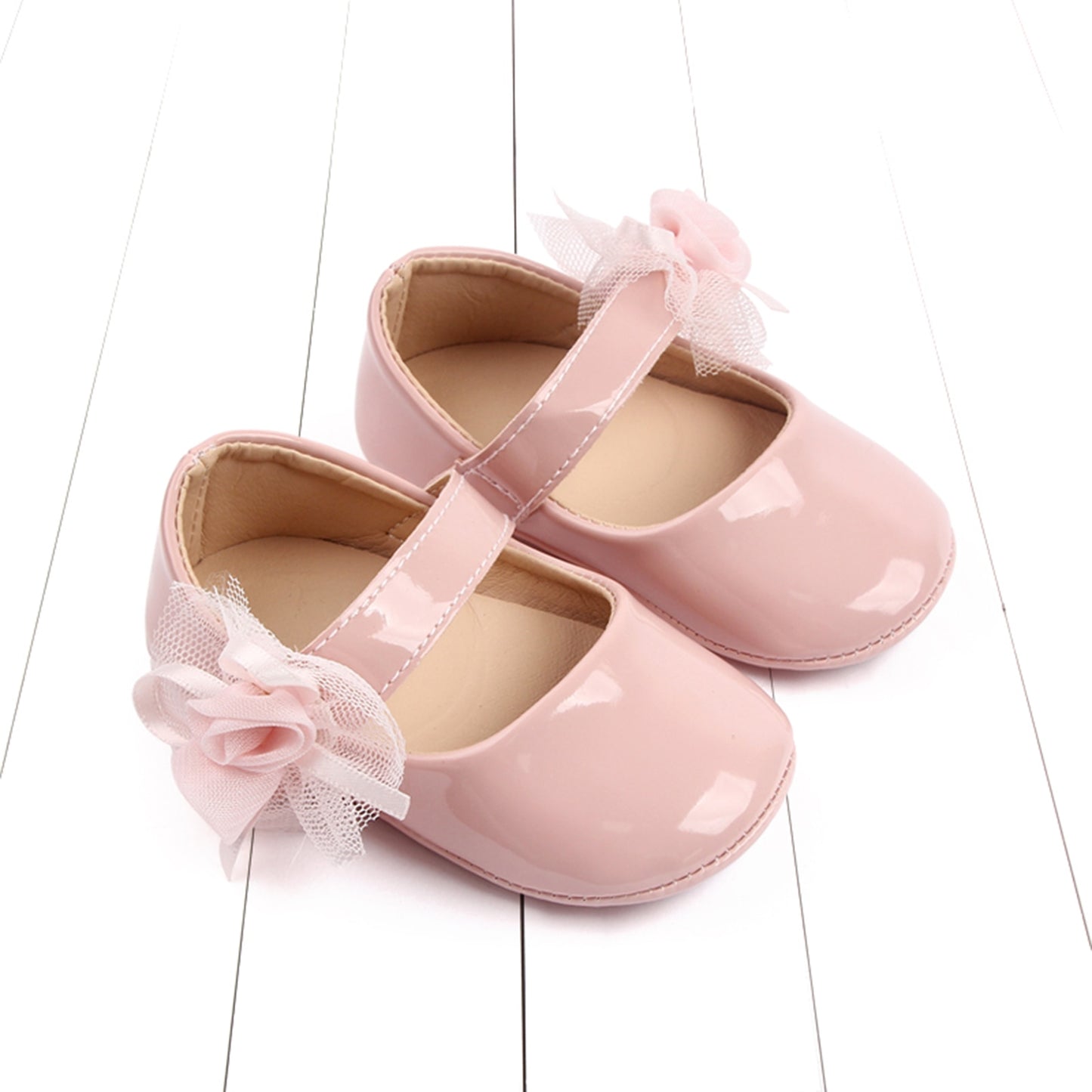 Zapatos de bebé con flor