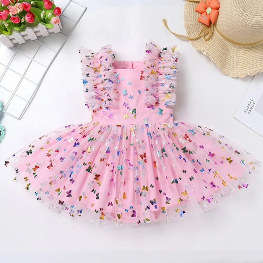 Vestido infantil con mangas con volantes y tul