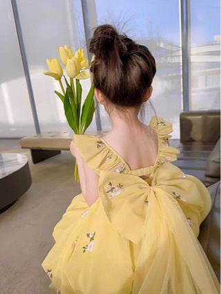 Vestido infantil amarillo con lazo de flores pequeñas