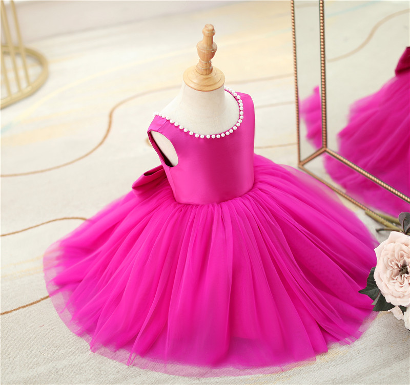 Vestido de fiesta infantil con lazo rosa