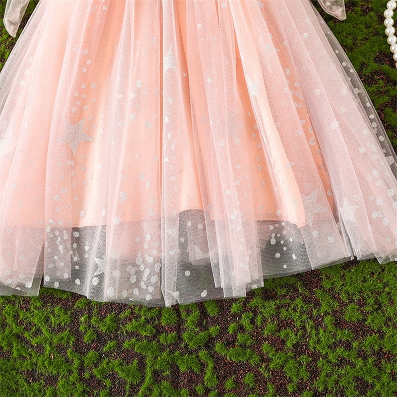 Vestido infantil con tirantes y lazo de tul