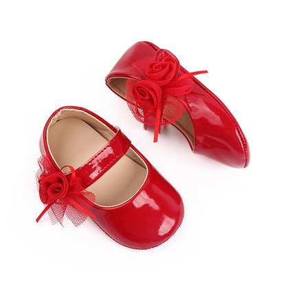 Zapatos de bebé con flor