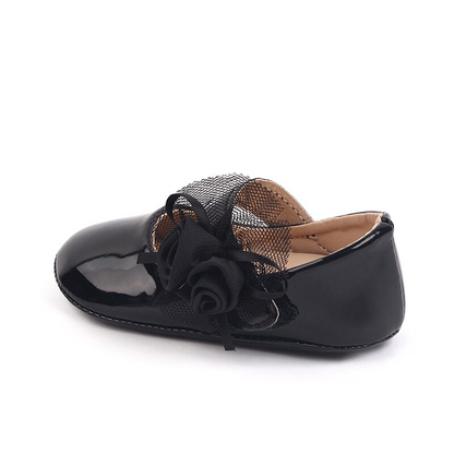 Zapatos de bebé con flor