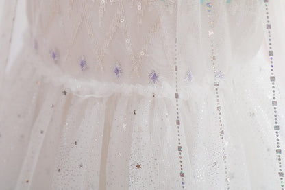 White children's dress with glitter.
