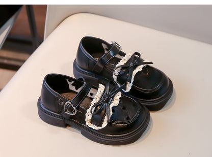 Zapatos de niña con lazo de amor 
