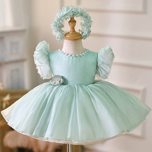 Vestido de fiesta verde con perlas y flores 