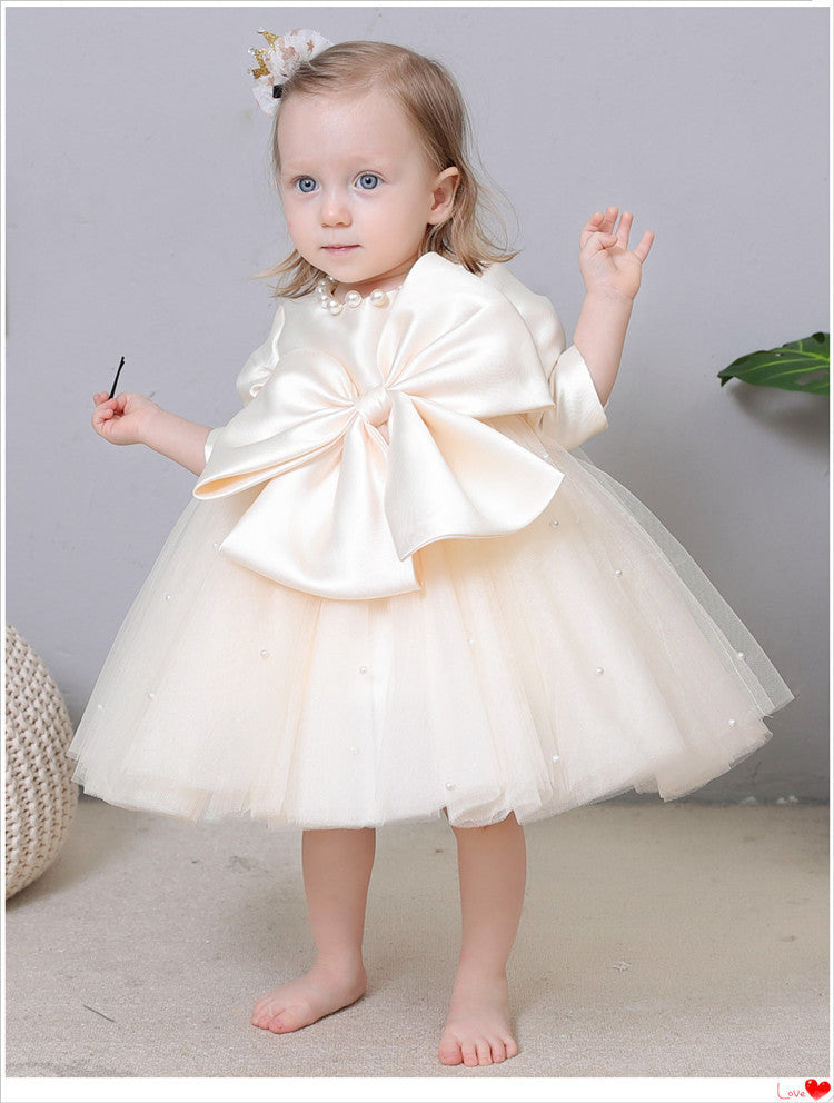 Vestido de fiesta infantil con perlas y lazo