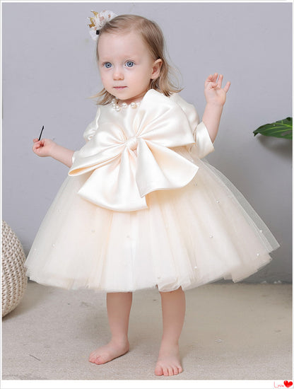 Vestido de fiesta infantil con perlas y lazo