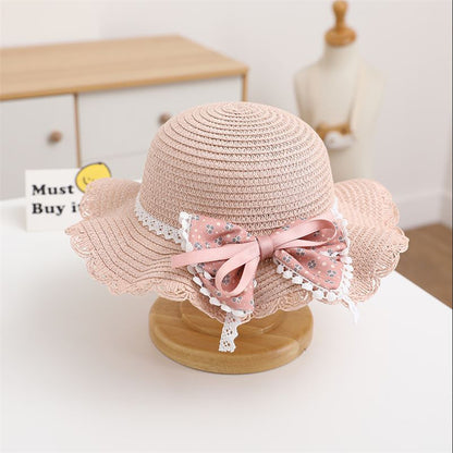 Sombrero infantil con lazo de flores 