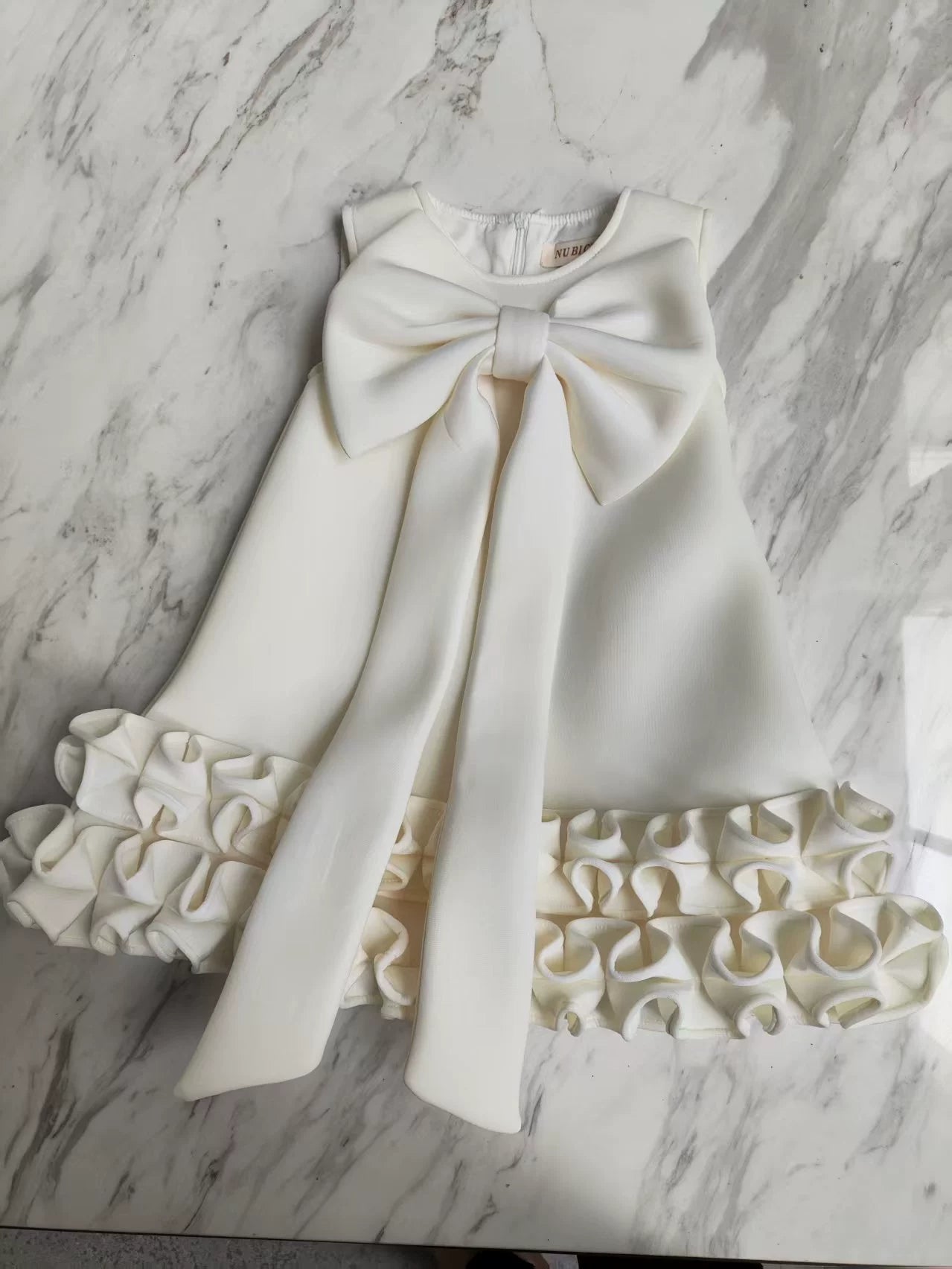 Children's Dress with Ruffles and Bow Hem