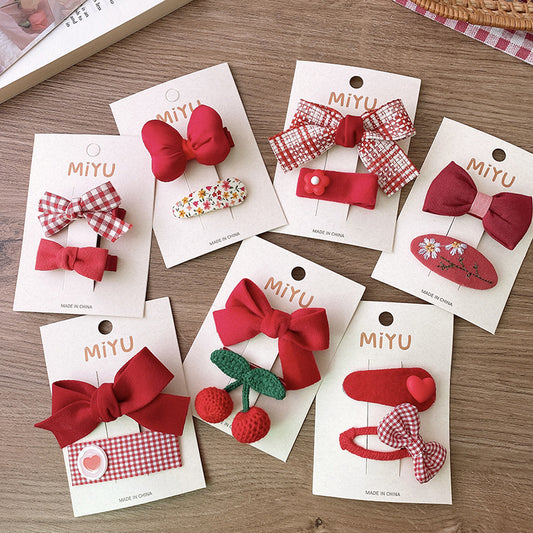 Clips para niños con lazos rojos