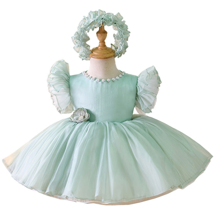 Vestido de fiesta verde con perlas y flores 