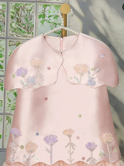 Floral dress for girls with tulle trim.