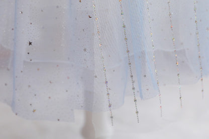 White children's dress with glitter.