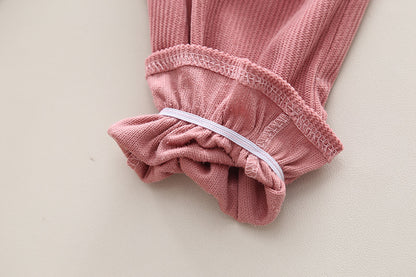 Conjunto infantil de mujer con botones de lazo 