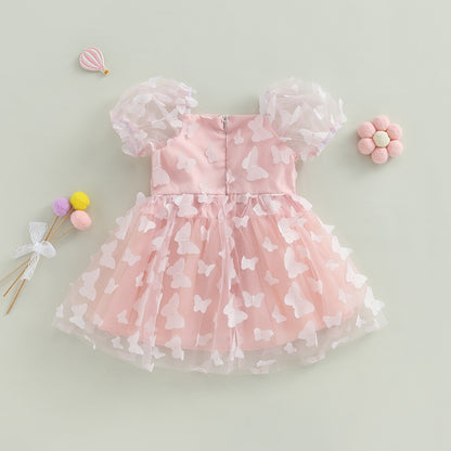 Vestido infantil de tul azul con flores de colores.