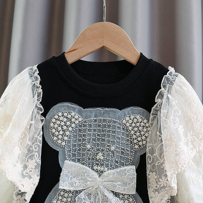 Vestido infantil con oso y encaje. 