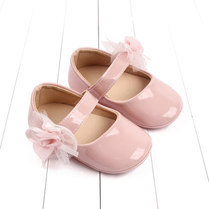 Zapatos de bebé con flor