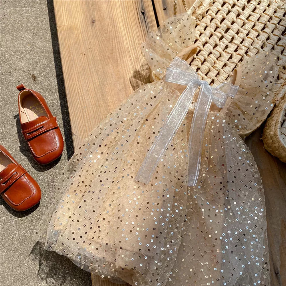 Vestido infantil con lazo y lentejuelas 