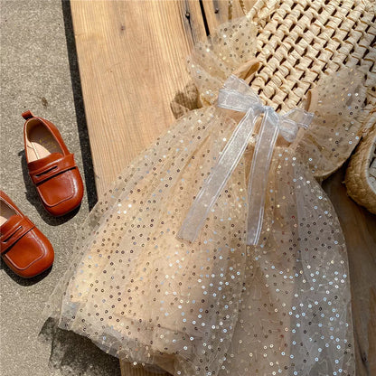 Vestido infantil con lazo y lentejuelas 