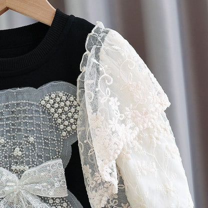 Vestido infantil con oso y encaje. 