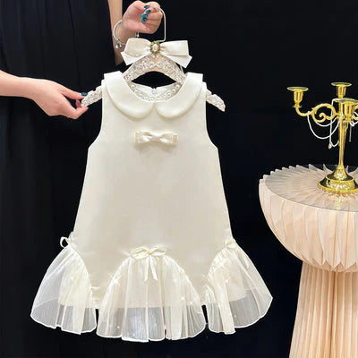 Vestido infantil con cuello y lazos 