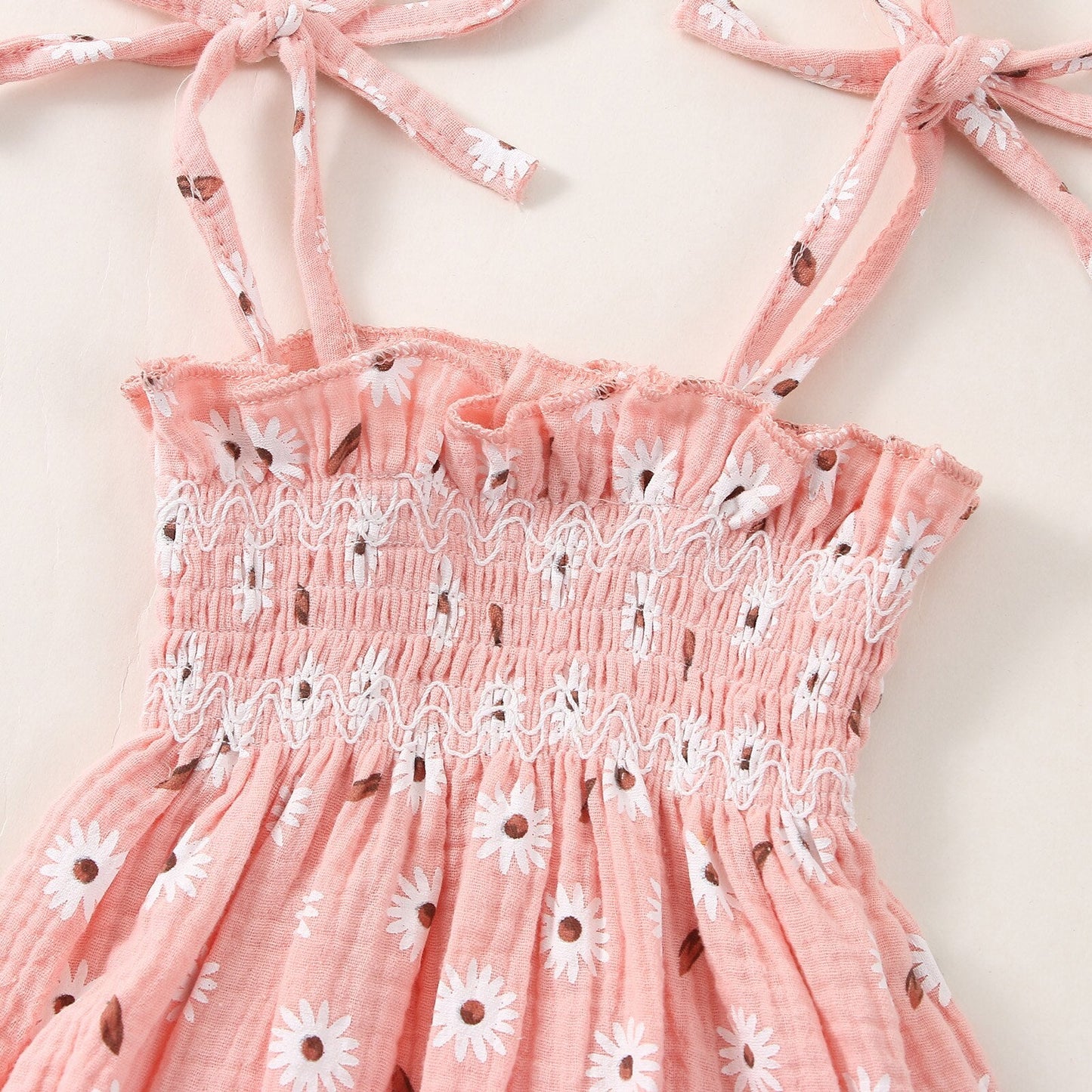 Body infantil con flores y fajín