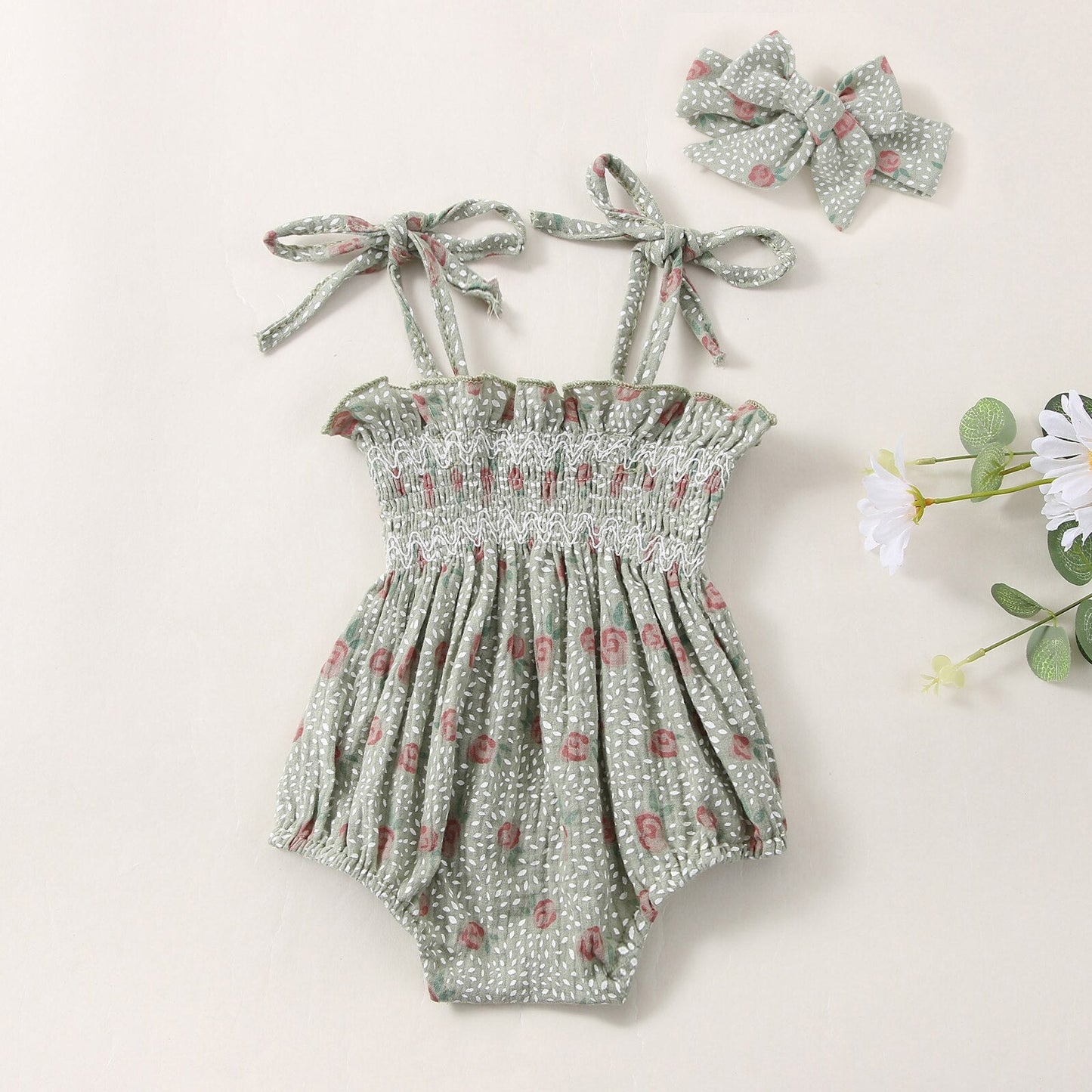 Body infantil con flores y fajín
