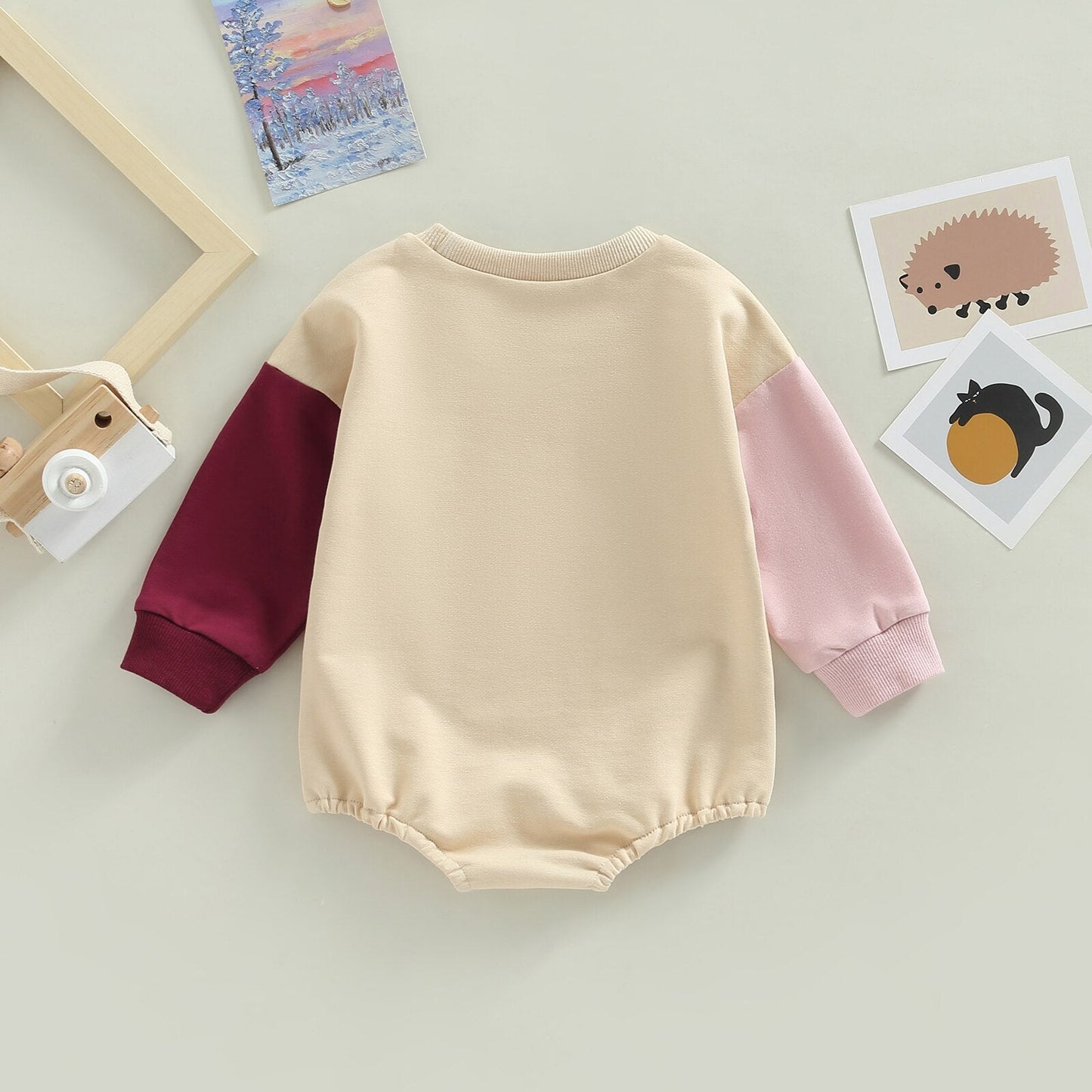 Body infantil con mangas de colores