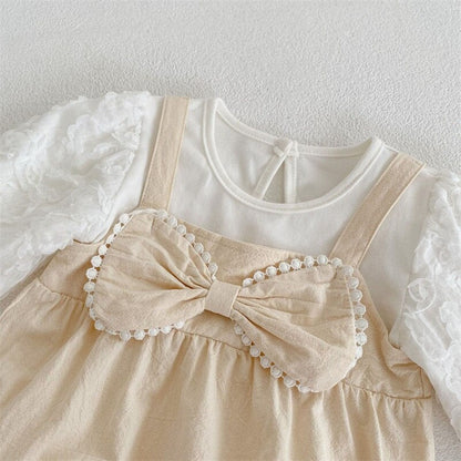 Body infantil beige y blanco
